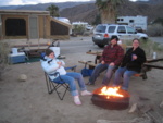 Erin, Greg, and Kate by the camp fire.