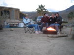 All of us enjoying the fire, and Greg taking a swig off the lighter fluid.  Yum!