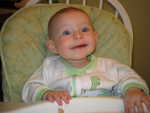 There's a grin!  I can't figure out how to get pictures of Ruby's brand new teeth yet, still too small and she won't let me.  I can't believe she got both the bottom ones at the same time and right at 7-months-old.
