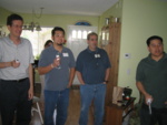Chad's coworkers playing Nintendo Wii bowling.